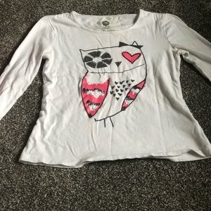 4 White t-shirts with graphic designs